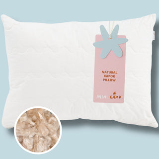 Natural kapok sleeping pillow with 100% organic cotton cover by MINICAMP – vegan-friendly, hypoallergenic filling with adjustable firmness.